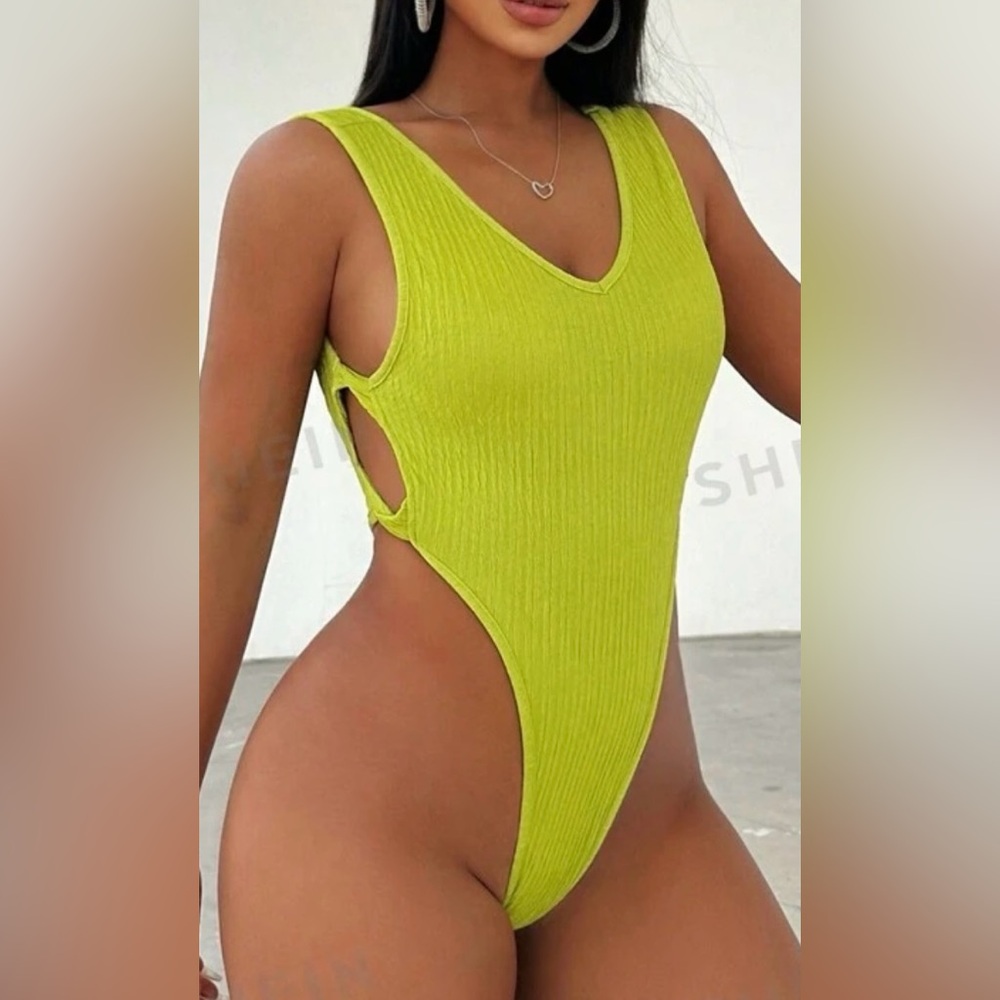 Green high and side cut body suit size small in women's. Never worn